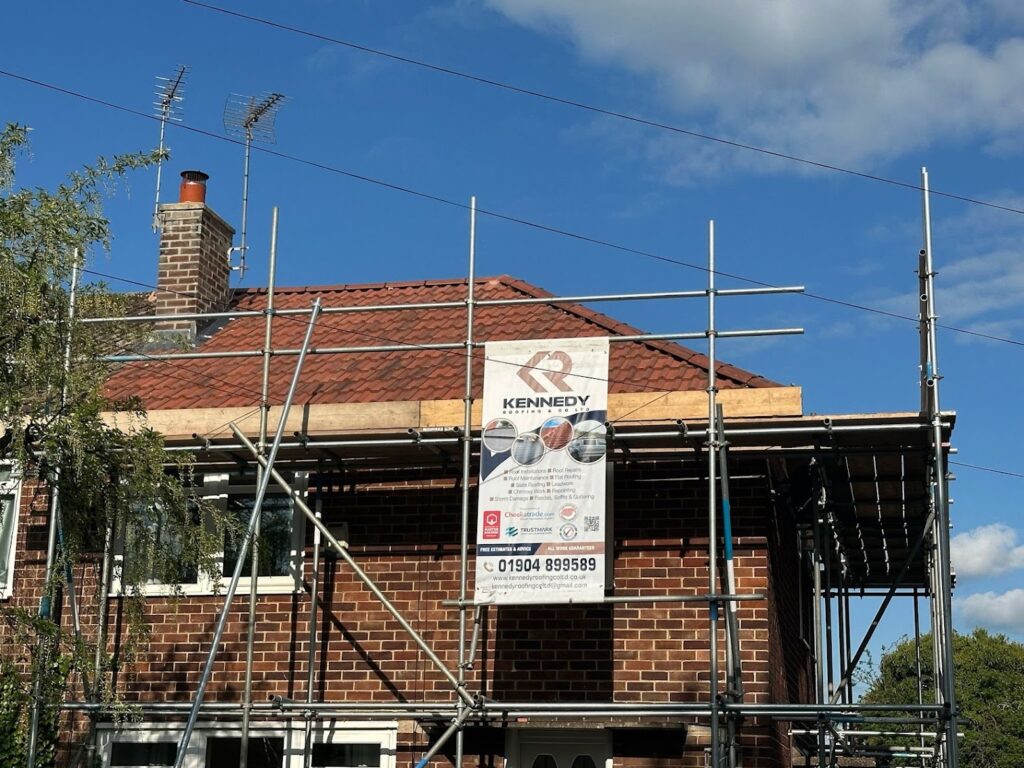 new3 a house with scaffolding | Kennedy Roofing
