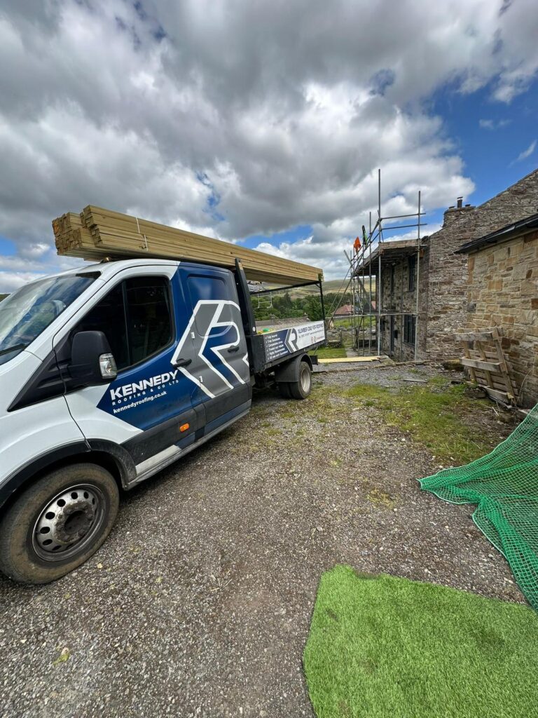 A roofing van outside a property | Kennedy Roofing